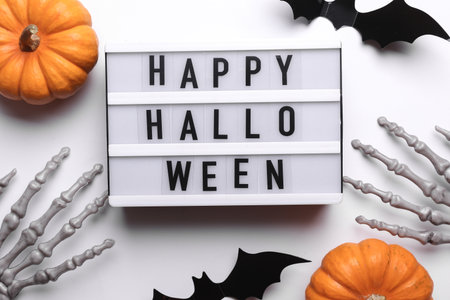 Lightbox with text HAPPY HALLOWEEN and holiday decor. Halloween celebration. Flat layの写真素材