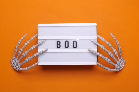 Halloween concept. Lightbox with text BOO and holiday decoration. Flat lay. Top viewの写真素材