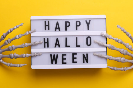 Lightbox with text HAPPY HALLOWEEN and holiday decor. Halloween celebration. Flat layの写真素材