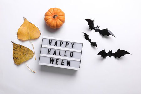 Lightbox with text HAPPY HALLOWEEN and holiday decor. Halloween celebration. Flat layの写真素材
