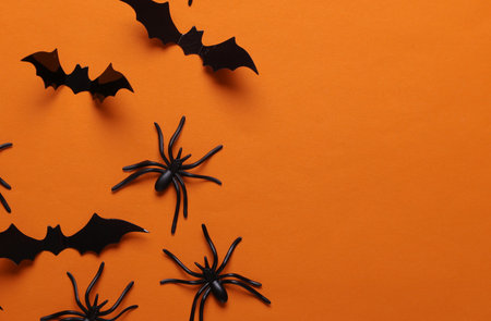 Halloween decoration spiders and bats on orange backgroundの写真素材