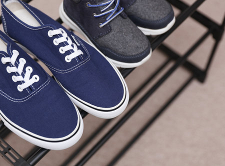 Metal shoe rack with shoes close upの写真素材