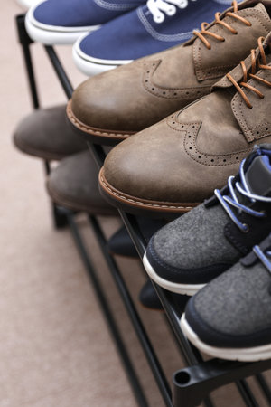 Metal shoe rack with shoes close upの写真素材