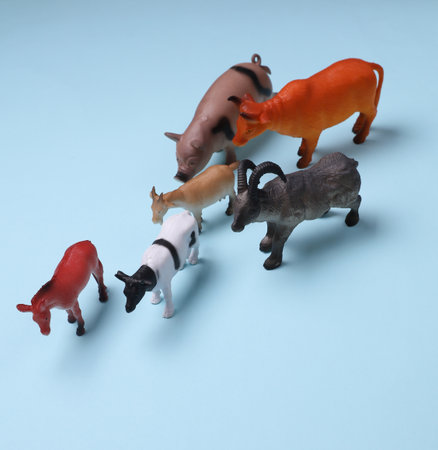 Toy farm set of animals on blue backgroundの写真素材