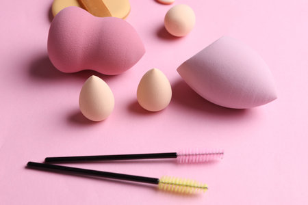 Set of cosmetic sponges blenders for makeup on pink backgroundの写真素材