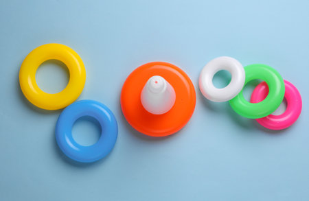 Children's plastic pyramid with rings on a blue backgroundの写真素材