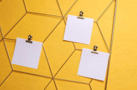 White square memo cards mockups attached to gold grid mood board on yellow background