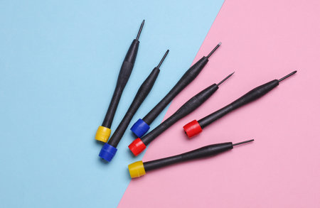 Set of collet screwdrivers on pink blue background