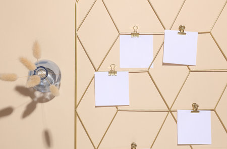 White square memo cards mockups attached to gold grid mood board on beige background