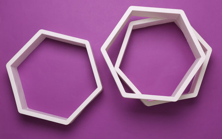 Hexagonal honeycomb wall shelves on purple backgroundの写真素材