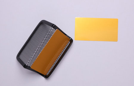 Golden business cards and metal stand on gray backgroundの写真素材