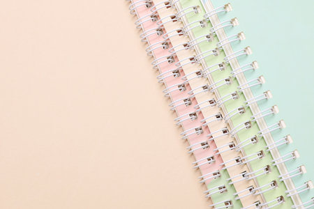 Spiral binding notebooks on beige backgroundの写真素材