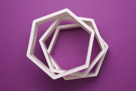 Hexagonal honeycomb wall shelves on purple background