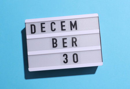 Lightbox calendar with text December 30 on blue background