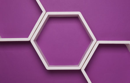 Hexagonal honeycomb wall shelves on purple background