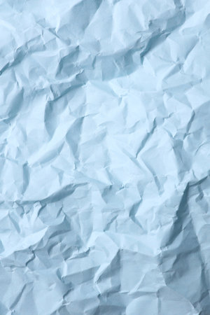 Crumpled blue paper background. Natural textureの写真素材