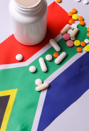 South Africa flag and pills. Concept of health careの写真素材