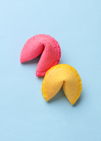 Two fortune cookies on a blue backgroundの写真素材