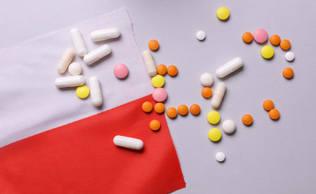 Poland flag and pills. Concept of health care