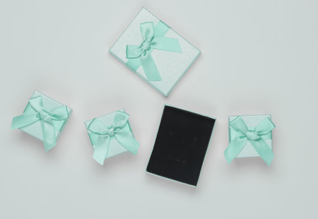 Gift boxes with bows on white background. Composition for christmas, birthday or wedding.