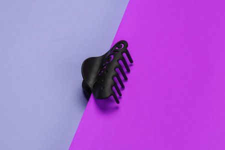 Hair clip on pink purple background close-up. Studio shotの写真素材