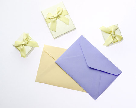 Gift boxes with bows, envelopes isolated on white background.の写真素材