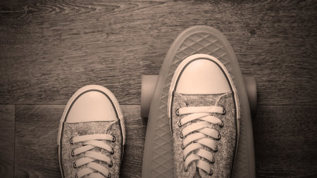 Cruiser board with sneakers on the floor. Top viewの写真素材