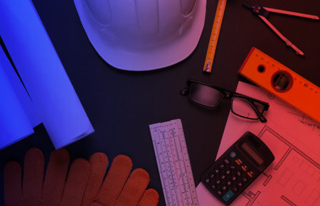 Engineering and construction equipment in red blue neon lightの写真素材