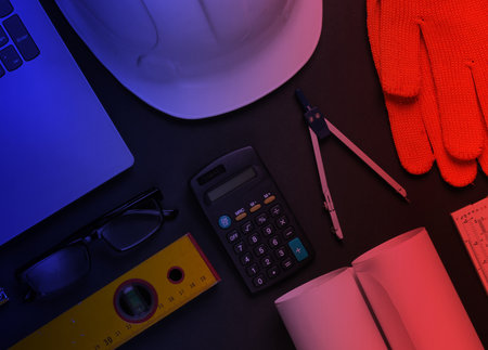 Engineering and construction equipment in red blue neon lightの写真素材