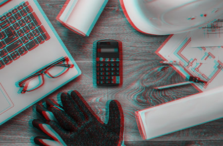 Creative layout of architects with architectural project plan, engineering tools and stationery, laptop on floor, workspace. Top view. Flat lay.の写真素材