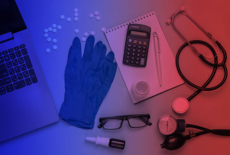 Doctoral supplies and tools, notebook in neon light. Doctor workspace. Top view. Flat layの写真素材