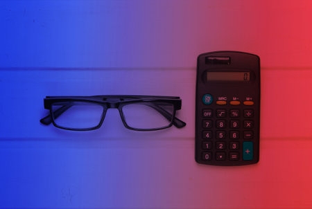 Calculator with glasses. Neon lightの写真素材