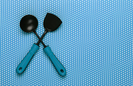 Toy kitchen tools on a polka dot tablecloth. Top viewの写真素材
