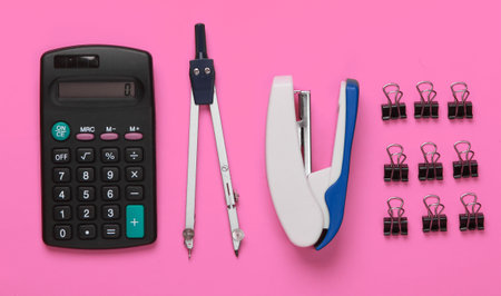 Flat lay composition of office tools, stationery on pink background. Working space. Top viewの写真素材