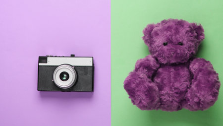 flat lay composition of a teddy bear, camera on pastel background. Tourism concept. Top viewの写真素材