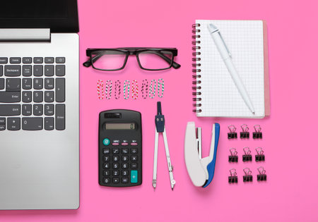 Flat lay composition of office tools, stationery on pink background. Top view