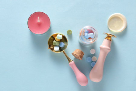 Wax Seal Making Kit on Blue Background. Top View. Flat Layの写真素材