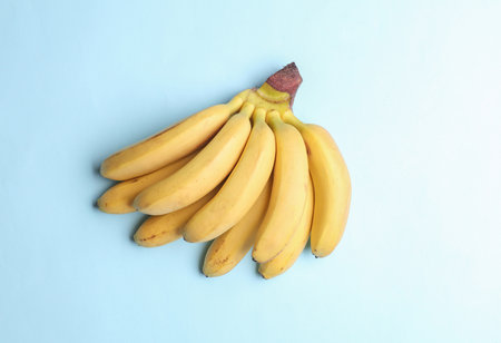 Miniature bananas on a blue backgroundの写真素材