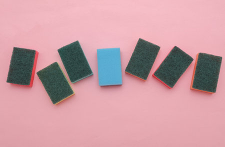 Set of colored cleaning sponges on a pink backgroundの写真素材
