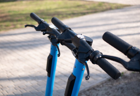 Close up of electric scooter handlebars in park