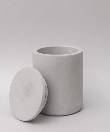 Concrete cup for candle on gray backgroundの写真素材