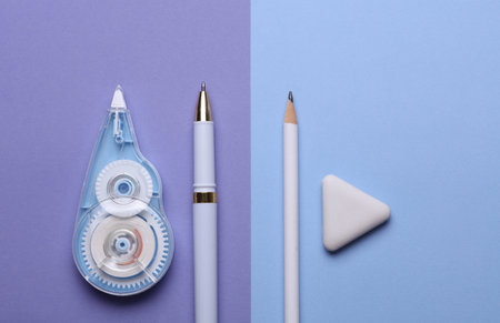Set of stationery on purple background. Top view. Flat lay