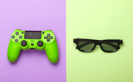 Green Gamepad, 3d glasses on pink, green pastel background. Gaming, leisure and entertainment...