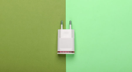 Charger on pastel background. Top view