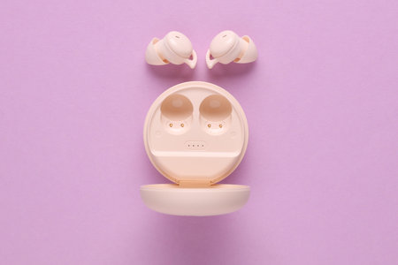 Modern Wireless Bluetooth Vacuum Earbuds with Charging Case on Purple Background