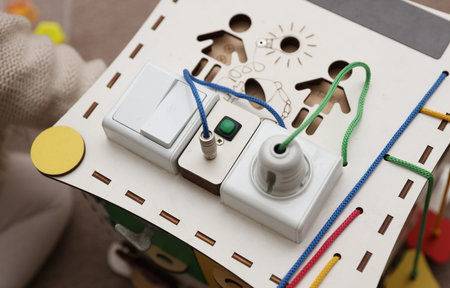 Wooden cube for developing motor skills of small children