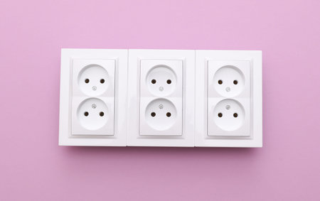 Electrical sockets on a purple backgroundの写真素材
