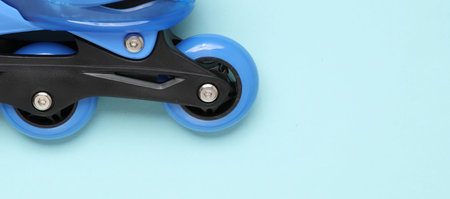 Children's roller skates on a blue background