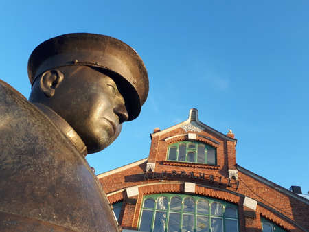 Oulu, Finland - June 2020: Market hall Kauppahalli in Oulu, Finland. Bronze statue of police officer in front of itのeditorial素材