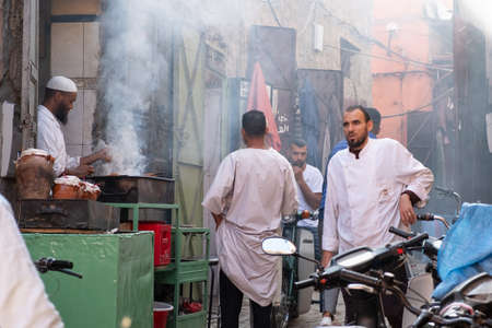 Restaurant on the street, serving food and grilling meat in Marrakesh, Moroccoのeditorial素材